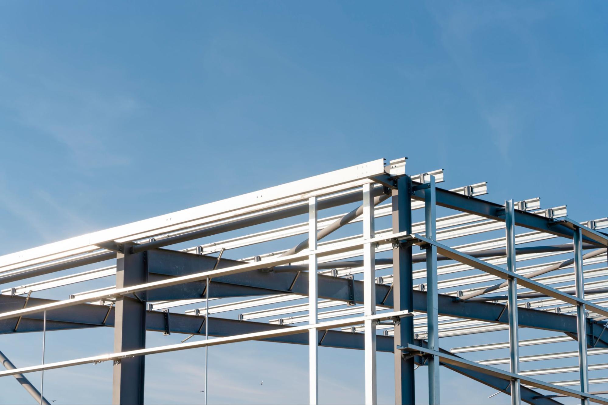 image of steel building structure in a blue sky