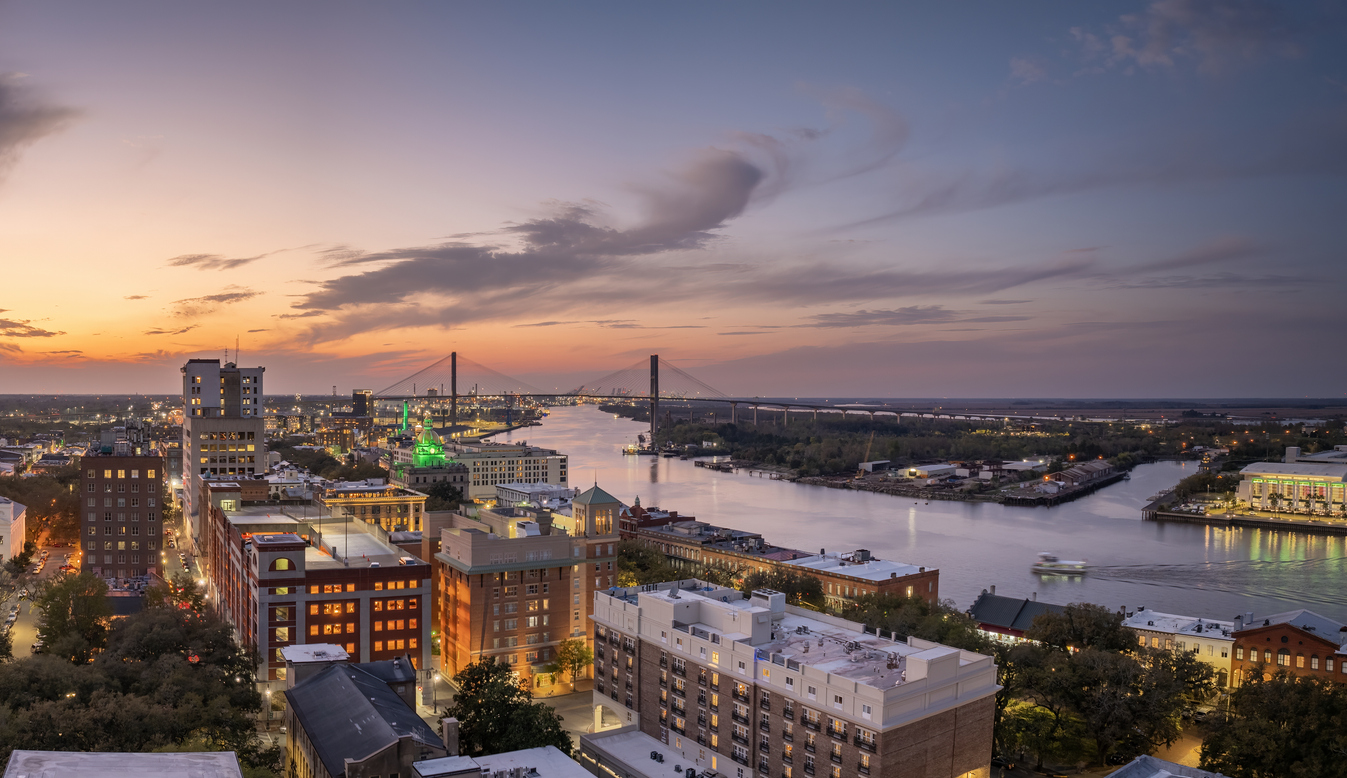 Waterfront River Street in Savannah, Georgia. Historic American architecture of old historical city. USA Southern cityscape at sunset.
